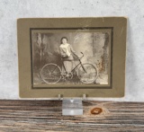 Woman with Bicycle Cabinet Photo