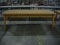Light brown wooden table (8'x2'7