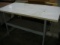 White work table with metal legs (5'x2'6