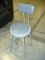 Gray sitting stool with back support