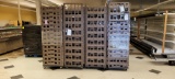 STACK OF PLASTIC TRAYS WITH DOLLY, ALL STACKS  7' TO 8' HIGH, QUANTITIES PE