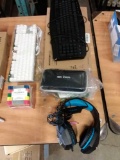Two keyboards/3 1/2 disks/ Gaming headset/3D pen