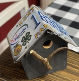 This is a handcrafted birdhouse made by self-taught artist Vicki Bangs of West Point, KY.
