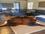 Brand New Cowhide Rug it measures 6ft by 8ft.