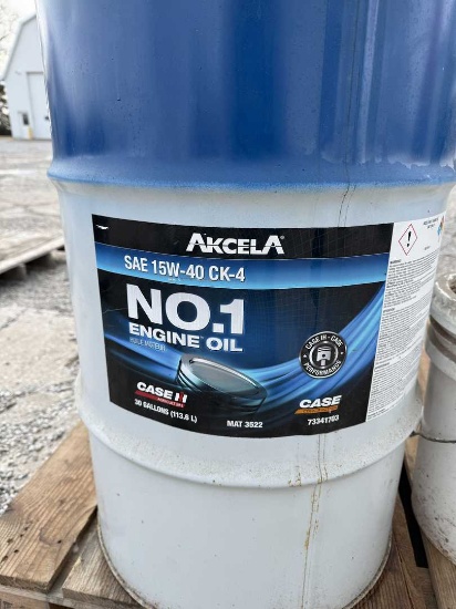 30-Gal drum of Case 15w-40 oil w/ 2.5 gal funnel jug