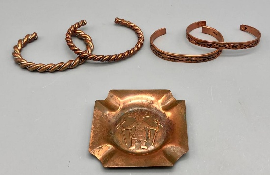 Group of Four Copper Bracelets and a Copper Ashtray