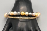 One Gold and One Pearl Gold Bracelets