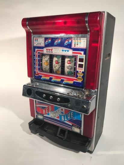 Edelbrock. “Red, White, Blue” Counter Top Slot Machine