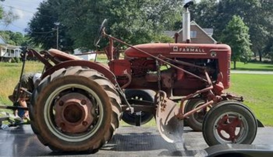 Farmall Tractor. Selling Two Plows with it