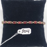 6.8g 10k Yellow Gold/Garnet Tennis Bracelet