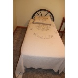 Antique iron twin bed with covers