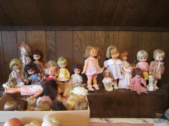 Baby dolls on headboard and 2 boxes