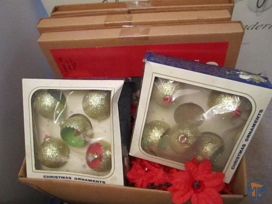 Christmas decorations: nativity figurines, ornaments, poinsettia string lights