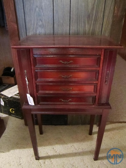 Jewelry cabinet and contents: necklaces, elephant broach, and marble
