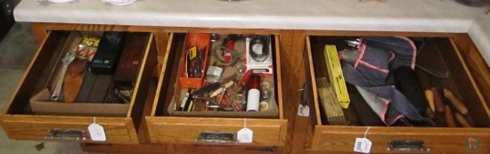 Folding tape measures, tool apron, gun cleaning tools, advertising bottle openers, drill bits