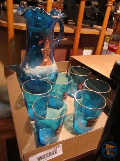 Blue glass pitcher with matching windmill glasses