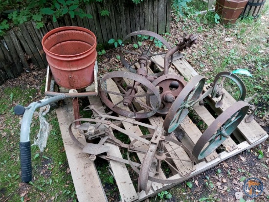 Steel wheeled garden implements and broadcast spreader