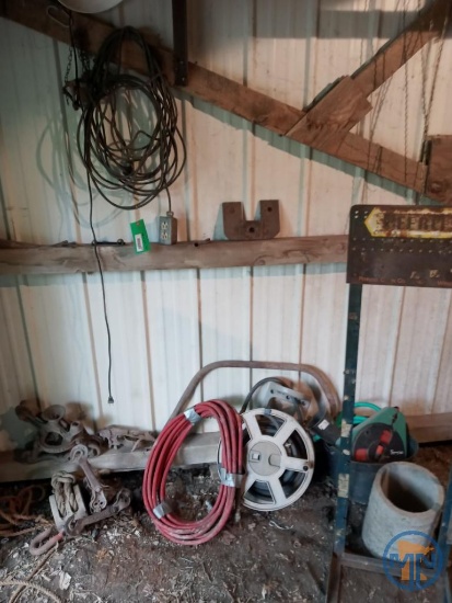 Items along southwest wall of lean-to: