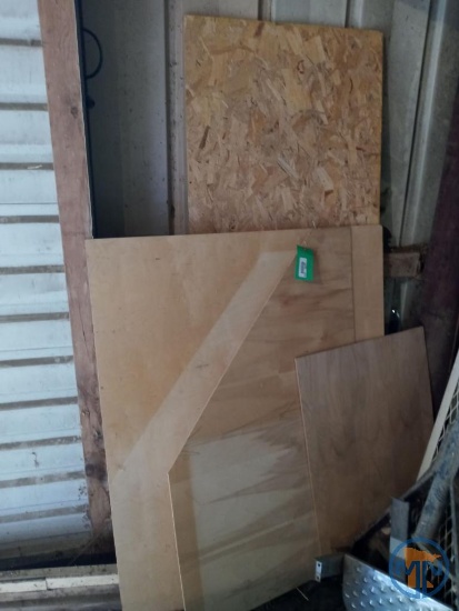 Veneered plywood and partial piece of oriented chip board