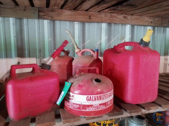 (4) Plastic fuel cans and 2.5 gallon metal Eagle gas can