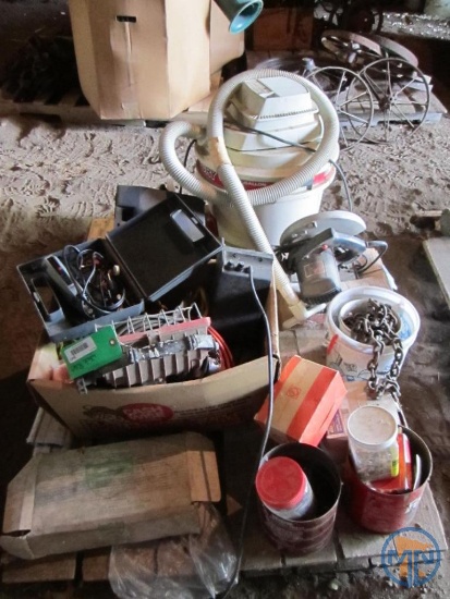 Contents of pallet: wet/dry vacuum, hardware, door thresholds, extension cords, work light
