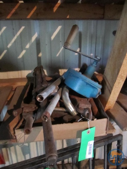 Old wrenches, manual oil pump, and hydraulic cylinder