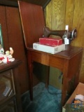 New Home light running electric sewing machine with cabinet and button holes