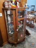Lighted curved front curio cabinet, 35