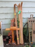 (4) sets of wheelbarrow handles, wood stand and plastic wall hanging