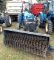 New Holland Workmaster 60 tractor with sweeper