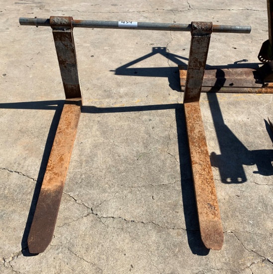 Loader forks on pipe