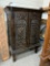 WOOD CABINET WITH CARVED PANEL DOORS