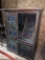 WOOD CABINET WITH CARVED PANEL DOORS