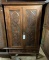 WOOD CABINET WITH CARVED PANEL DOORS