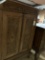 WOOD CABINET WITH CARVED PANEL DOORS