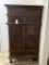 WOOD CABINET WITH CARVED PANEL DOORS
