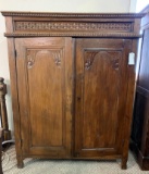 WOOD CABINET WITH CARVED PANEL DOORS