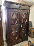 WOOD CABINET WITH CARVED PANEL DOORS