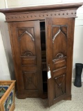 WOOD CABINET WITH CARVED PANEL DOORS