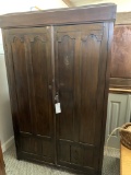 WOOD CABINET WITH CARVED PANEL DOORS