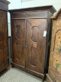 WOOD CABINET WITH CARVED PANEL DOORS