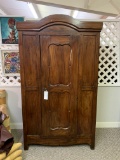 WOOD CABINET WITH CARVED PANEL DOORS