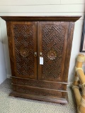 WOOD CABINET WITH CARVED PANEL DOORS