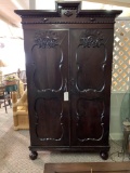 WOOD CABINET WITH CARVED PANEL DOORS