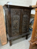 WOOD CABINET WITH CARVED PANEL DOORS