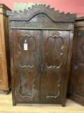 WOOD CABINET WITH CARVED PANEL DOORS
