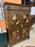 WOOD CABINET WITH CARVED PANEL DOORS