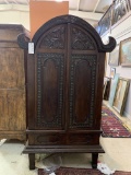 WOOD CABINET WITH CARVED PANEL DOORS