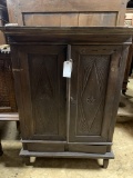 WOOD CABINET WITH CARVED PANEL DOORS