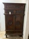WOOD CABINET WITH CARVED PANEL DOORS